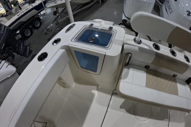 Slide: The Image of 2026 Bulls Bay 255 Center Console boat interior with seating and storage compartments. - 23