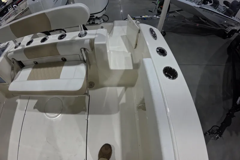 Slide: The Image of 2026 Bulls Bay 255 Center Console boat interior with seating and rod holders. - 24