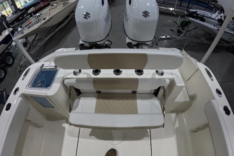 Slide: The Image of 2026 Bulls Bay 255 Center Console boat interior with dual engines and seating. - 26
