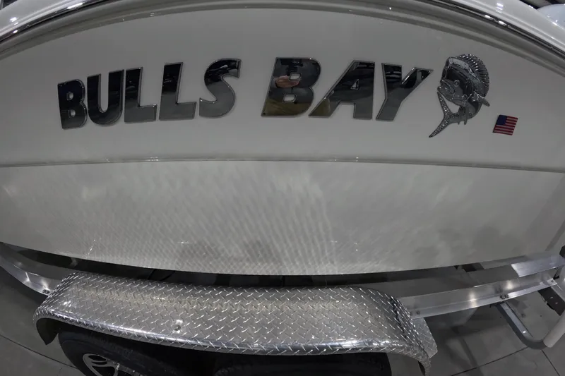 Slide: The Image of 2026 Bulls Bay 255 Center Console boat with logo and American flag emblem. - 27