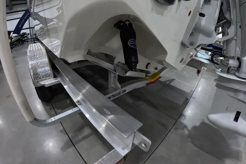 Slide: The Image of 2026 Bulls Bay 255 Center Console boat on trailer in a showroom. - 5