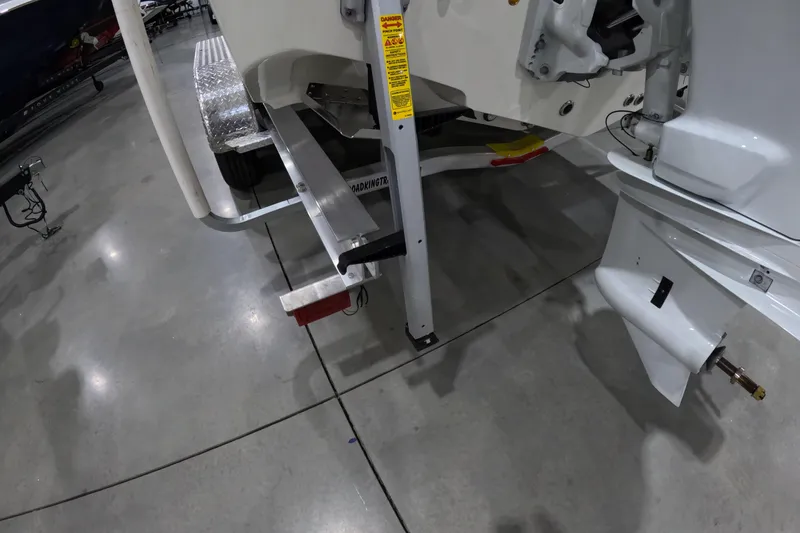 Slide: The Image of 2026 Bulls Bay 255 Center Console boat trailer and motor detail in showroom. - 6