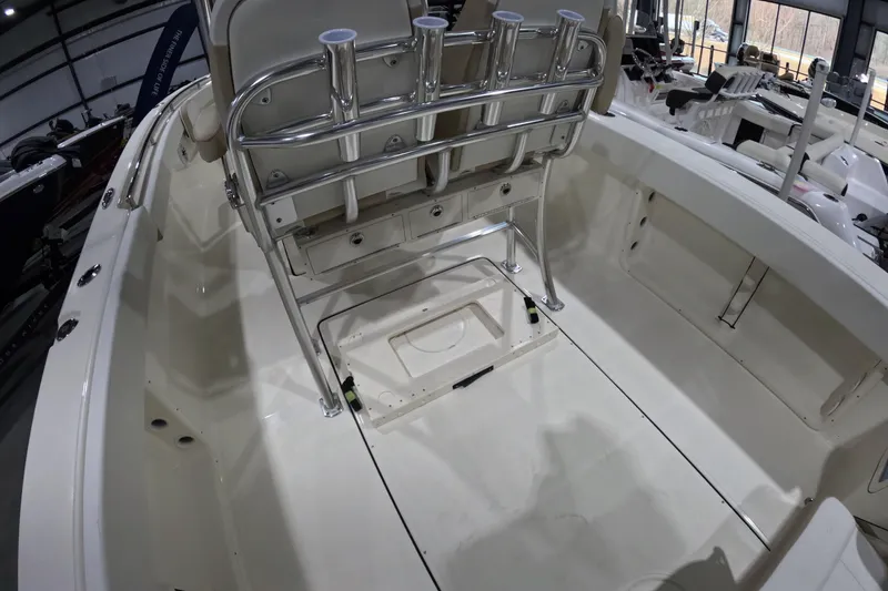 Slide: The Image of 2026 Bulls Bay 255 Center Console boat interior with rod holders and storage compartments. - 7