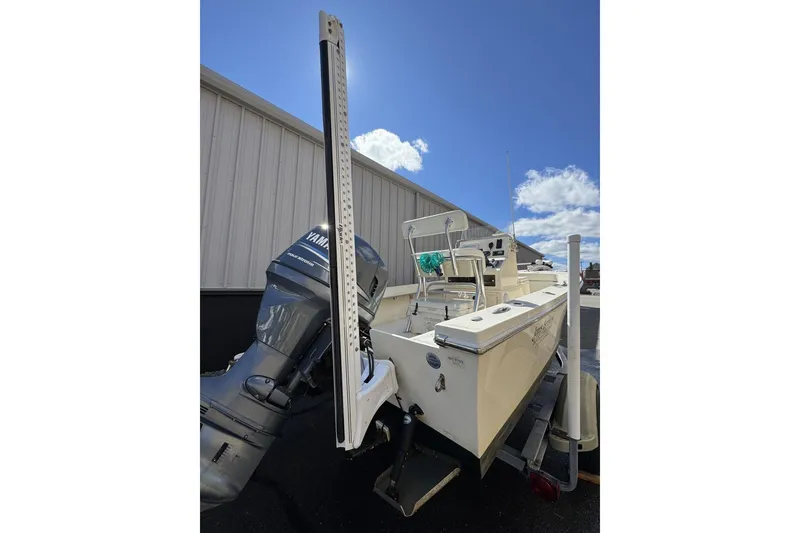 Slide: The Image of 2008 Jones Brothers Cape Fisherman 18 boat with Yamaha outboard motor, parked outdoors. - 7