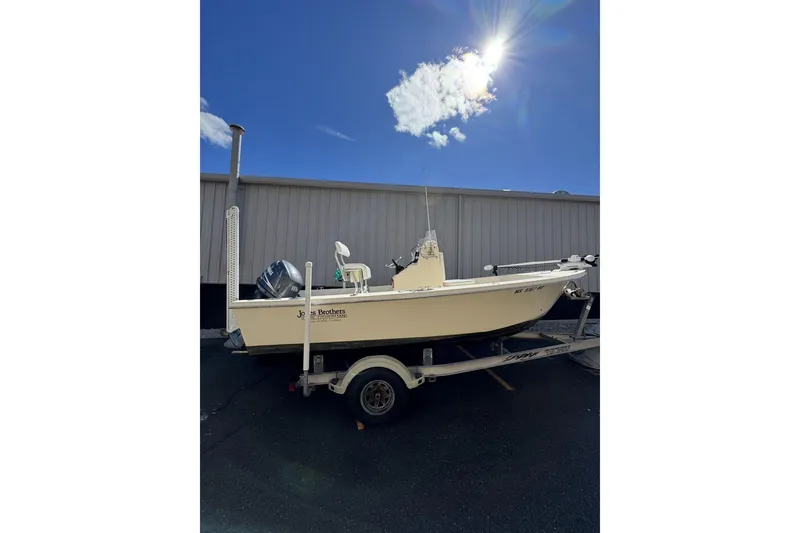Slide: The Image of 2008 Jones Brothers Cape Fisherman 18 boat on trailer under sunny sky. - 8