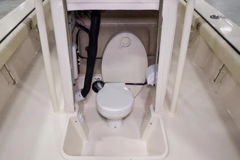 Slide: The Image of Manufacturer Provided Image: 2026 Carolina Skiff 24 Ultra Elite boat seat with beige and white upholstery. - 12