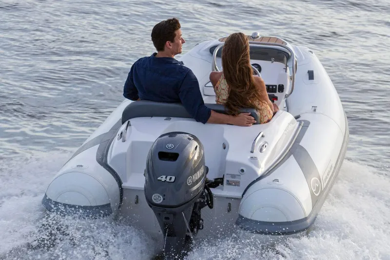 Slide: The Image of Manufacturer Provided Image: Couple cruising on 2025 Walker Bay Generation 360 DLX boat in open water. - 3
