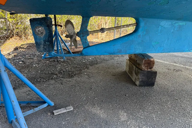 Slide: The Image of 2007 Fortier Express Cruiser underside with propeller and rudder, supported on stands. - 18