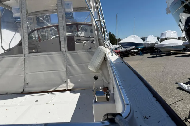Slide: The Image of 2007 Fortier Express Cruiser docked, showcasing cockpit and controls under clear blue sky. - 4