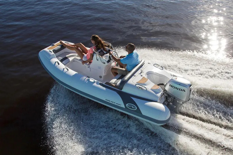 The Image of Manufacturer Provided Image: 2025 Walker Bay Generation 400 DLX boat cruising on water with Honda engine. - 0