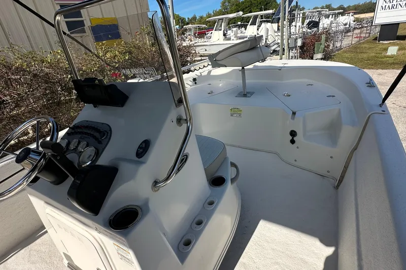 Slide: The Image of 2017 Carolina Skiff 198 DLV boat interior with steering console and seating. - 16