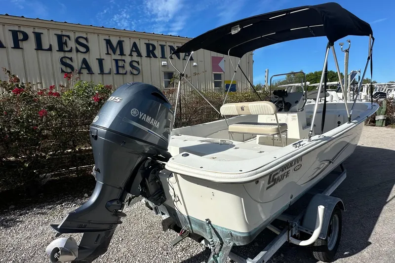 Slide: The Image of 2017 Carolina Skiff 198 DLV boat with Yamaha motor at marina sales. - 2