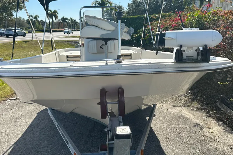 Slide: The Image of 2017 Carolina Skiff 198 DLV boat on trailer, parked outdoors. - 3