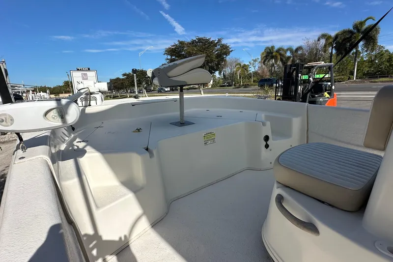 Slide: The Image of 2017 Carolina Skiff 198 DLV boat interior with seating and fishing chair. - 6