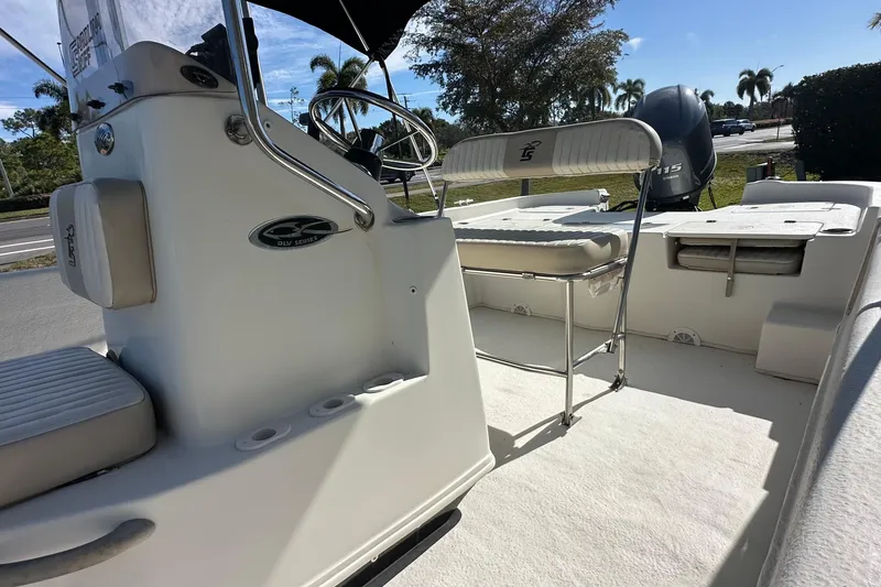 Slide: The Image of 2017 Carolina Skiff 198 DLV boat interior with steering console and seating. - 7