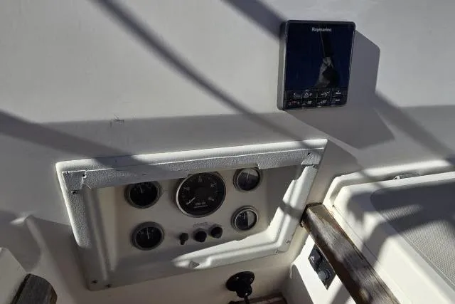 Slide: The Image of Control panel of a 1980 CAL 39 sailboat with Raymarine equipment. - 12