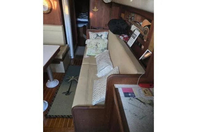 Slide: The Image of Interior of 1980 CAL 39 sailboat with cozy seating and nautical decor. - 4