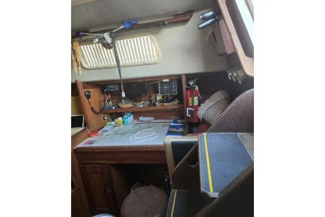 Slide: The Image of 1980 CAL 39 sailboat interior with navigation table and equipment. - 5