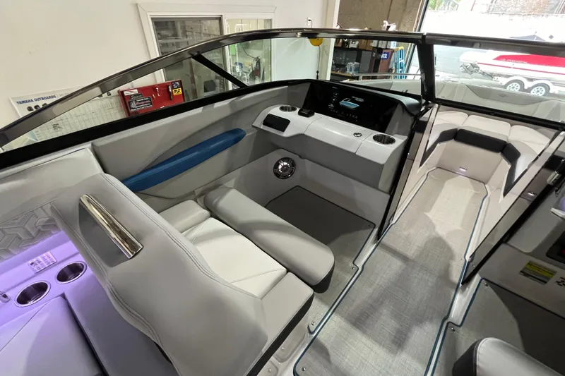 Slide: The Image of 2024 Regal LS4 Surf boat interior with modern seating and dashboard design. - 12