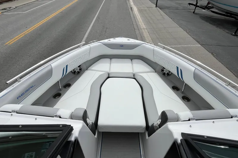 Slide: The Image of 2024 Regal LS4 Surf boat interior with spacious seating and modern design. - 16