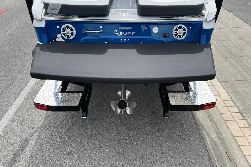 Slide: The Image of 2024 Regal LS4 Surf boat rear view with propeller and swim platform. - 4