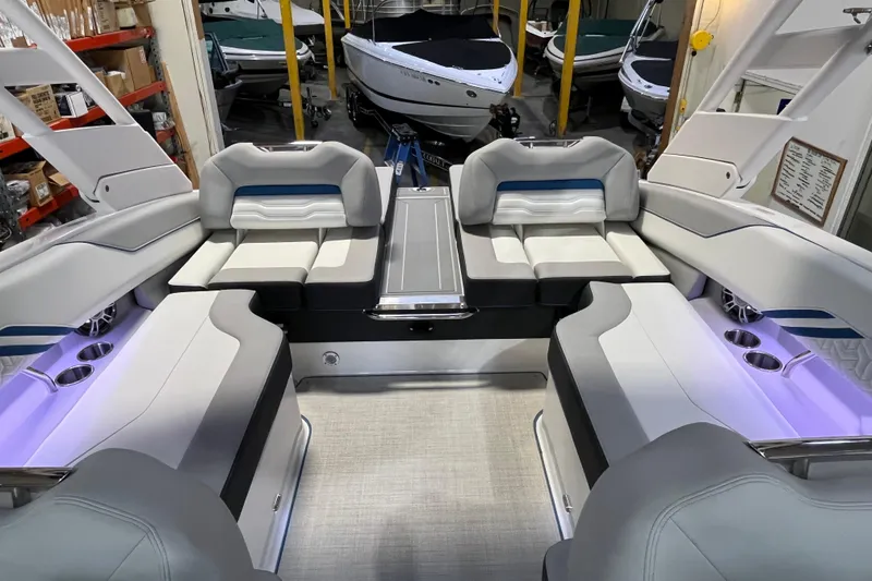 Slide: The Image of 2024 Regal LS4 Surf boat interior with luxurious seating and ambient lighting. - 7