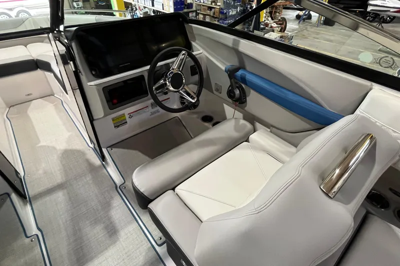 Slide: The Image of 2024 Regal LS4 Surf boat interior with modern steering and seating. - 9