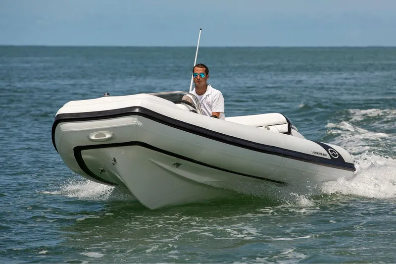 The Image of Manufacturer Provided Image: 2025 Walker Bay Generation 450 DLX boat cruising on open water. - 0