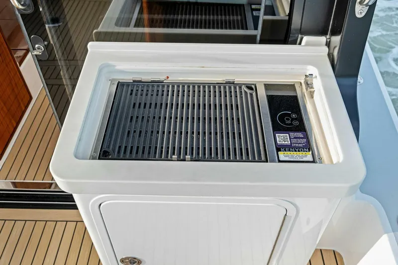 Slide: The Image of Outdoor grill on 2025 MJM 42 yacht, featuring Kenyon electric cooktop. - 27