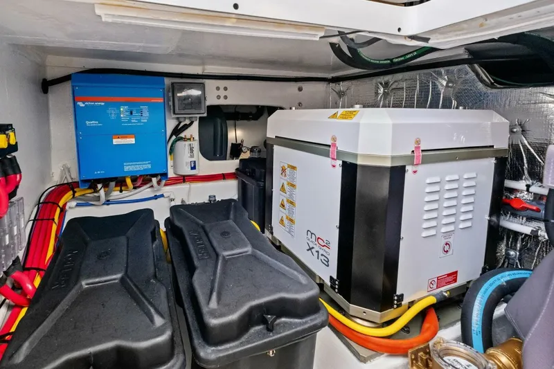 Slide: The Image of Engine room of 2025 MJM 42 boat with electrical equipment and wiring. - 31