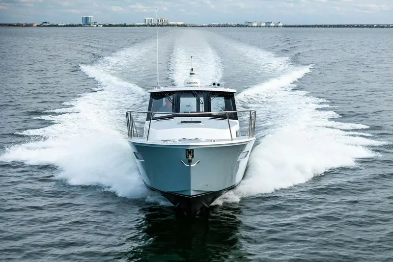 Slide: The Image of 2025 MJM 42 yacht cruising swiftly on open water. - 41