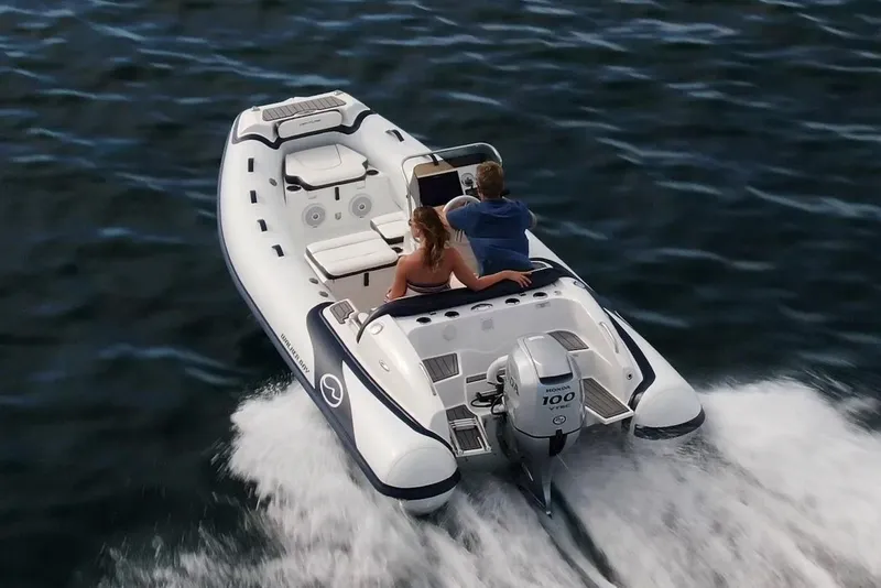 Slide: The Image of Manufacturer Provided Image: 2025 Walker Bay Venture 16 boat cruising on water with two passengers. - 3