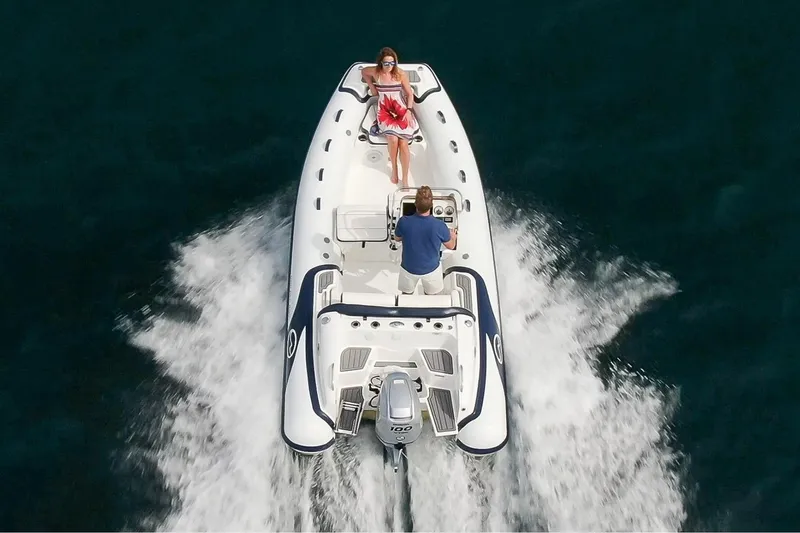 Slide: The Image of Manufacturer Provided Image: Walker Bay Venture 16 boat cruising on water, 2025 model, aerial view. - 5