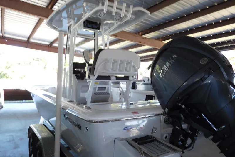 The Image of 2026 Tidewater 2110 Bay Max boat with Yamaha engine in covered storage. - 1