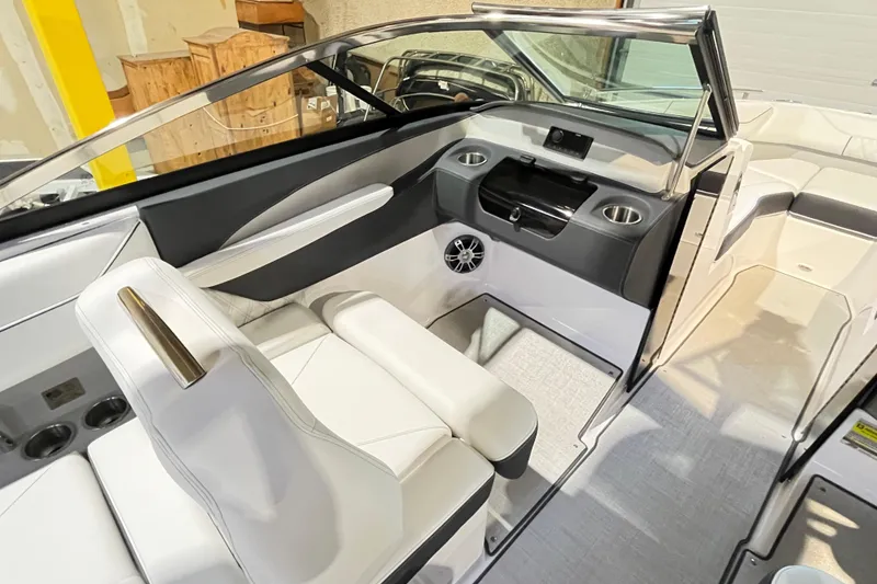 Slide: The Image of 2025 Regal LS4 boat interior with sleek white seating and modern dashboard design. - 7