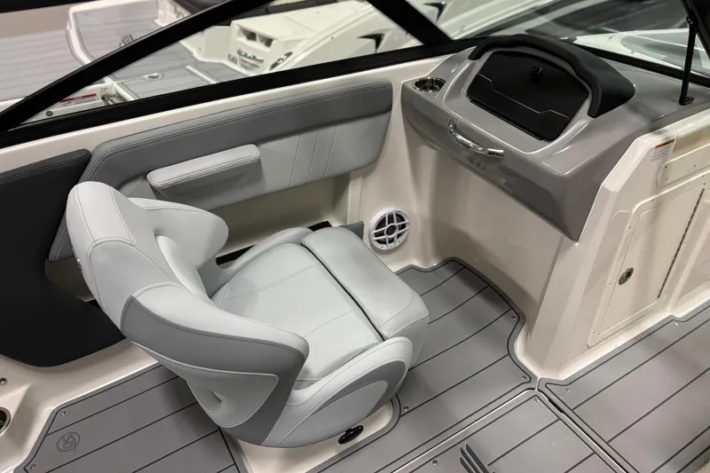 Slide: The Image of 2026 Chaparral 21 SSi OB boat interior with sleek seating and modern dashboard design. - 13
