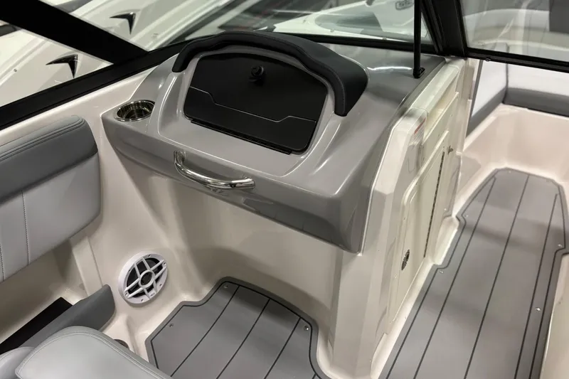 Slide: The Image of Interior of 2026 Chaparral 21 SSi OB boat, featuring sleek seating and modern design. - 17