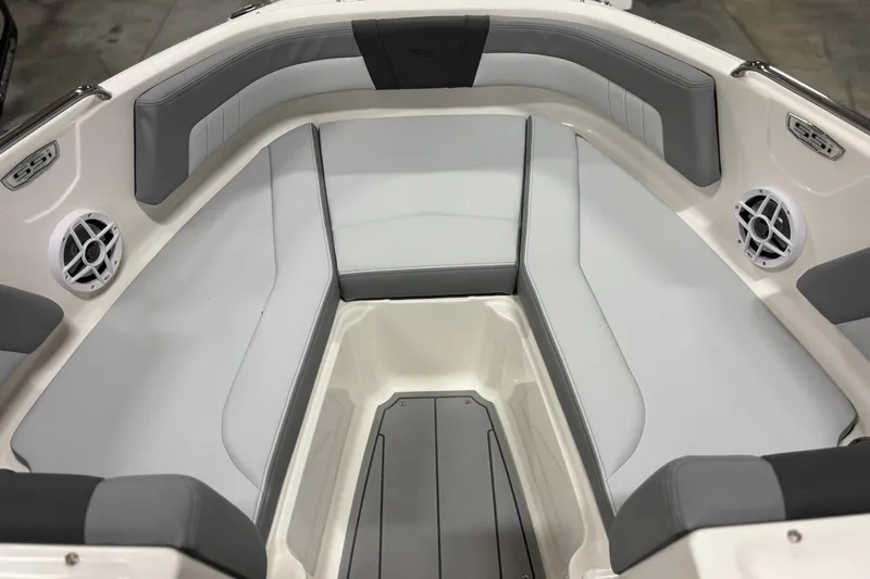 Slide: The Image of 2026 Chaparral 21 SSi OB boat interior with gray seating and speakers. - 20
