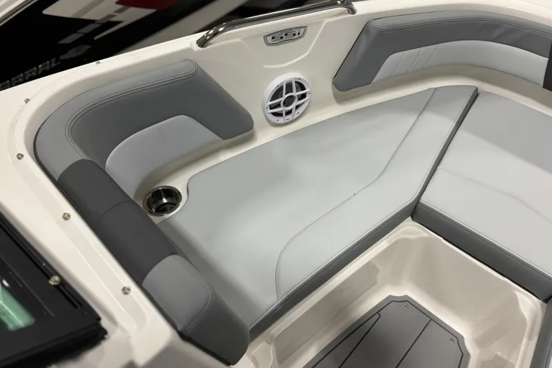 Slide: The Image of 2026 Chaparral 21 SSi OB boat interior with gray seating and speaker. - 21