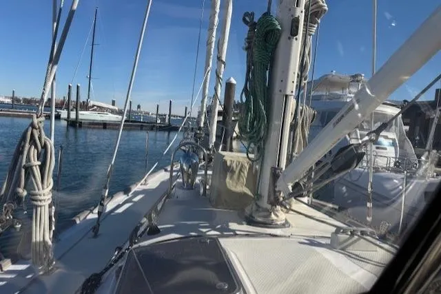 Slide: The Image of Sailboat deck view of a 2002 Hylas 46 in a marina setting. - 10