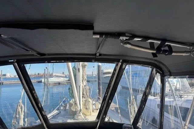 Slide: The Image of Interior view from a 2002 Hylas 46 sailboat, overlooking a marina. - 12