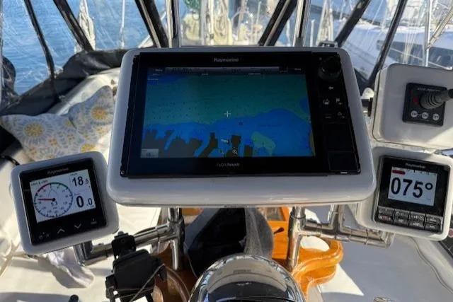 Slide: The Image of Cockpit of 2002 Hylas 46 yacht with navigation instruments and GPS display. - 15