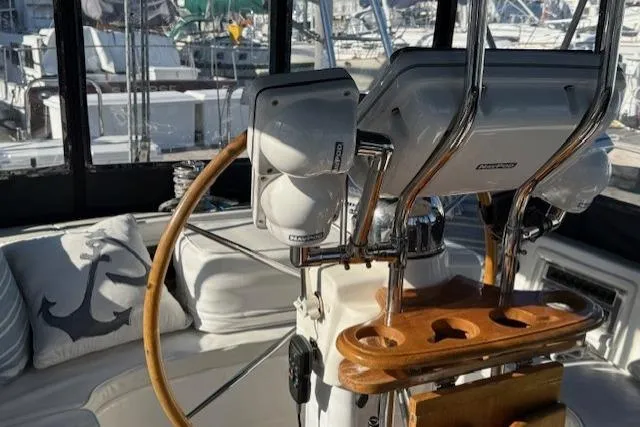 Slide: The Image of Cockpit of 2002 Hylas 46 yacht with steering wheel and navigation equipment. - 19