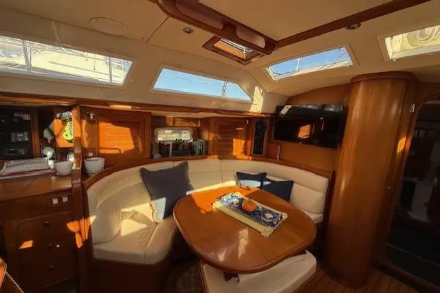 Slide: The Image of Luxurious interior of a 2002 Hylas 46 yacht with elegant wood finishes. - 28
