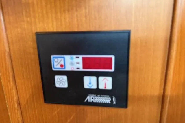 Slide: The Image of Control panel on 2002 Hylas 46 yacht, featuring digital display and buttons. - 35