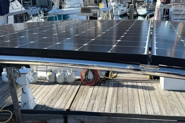 Slide: The Image of Solar panels on a 2002 Hylas 46 yacht docked at a marina. - 41
