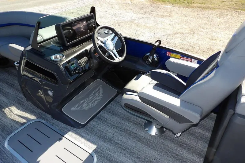 Slide: The Image of 2026 Bennington M Quad Bench 22 MFB boat interior with modern dashboard and comfortable seating. - 23