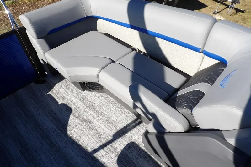 Slide: The Image of 2026 Bennington M Quad Bench 22 MFB with gray and blue upholstery on a boat deck. - 30