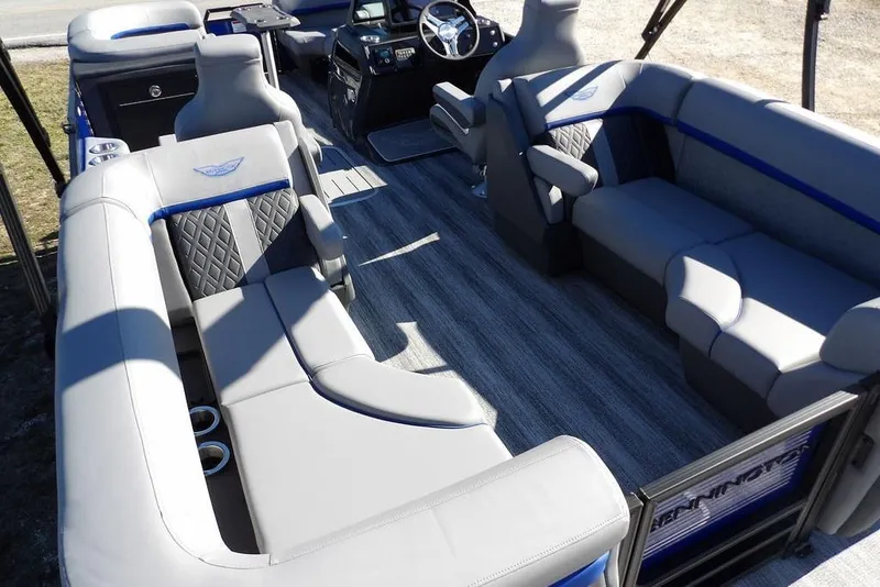 Slide: The Image of Luxurious interior of 2026 Bennington M Quad Bench 22 MFB pontoon boat. - 31