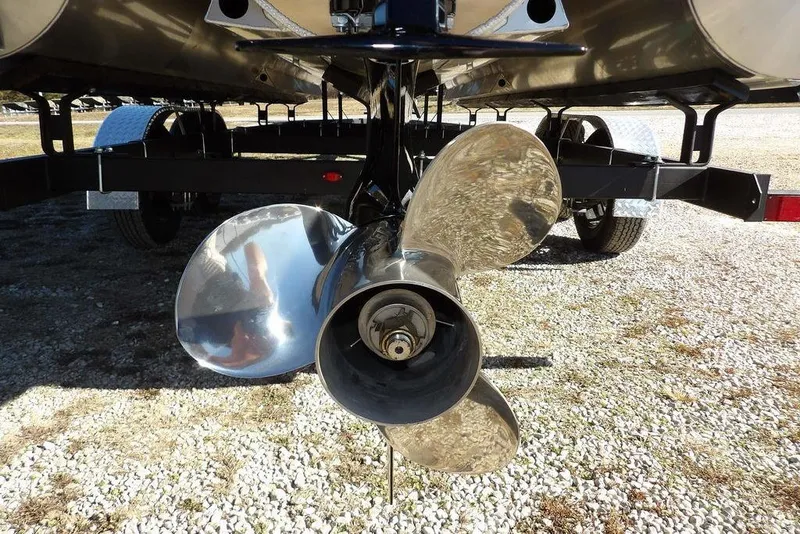Slide: The Image of 2026 Bennington M Quad Bench 22 MFB boat propeller on trailer, close-up view. - 38